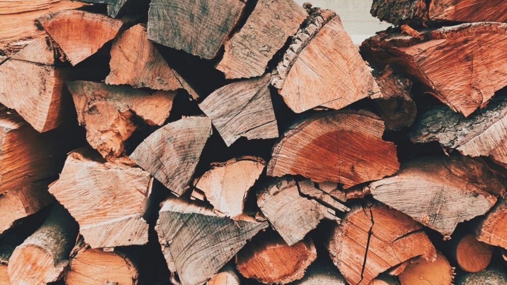 Split firewood stacked to season