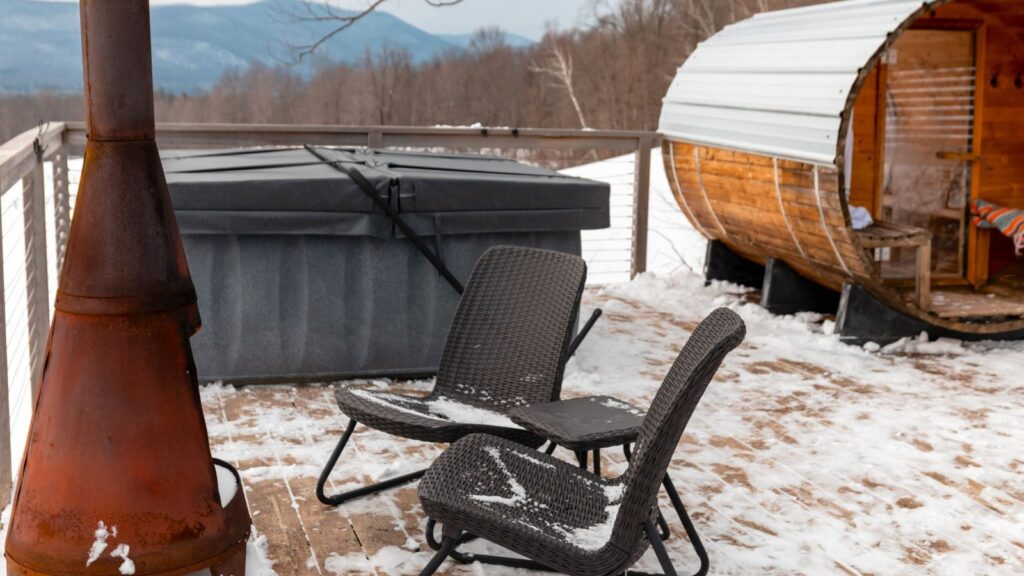 Metal chiminea on a snowy deck