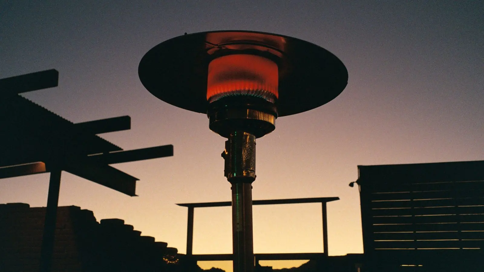 Patio heater glowing at dusk on an outdoor patio
